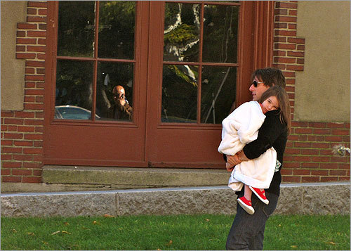 Tom Cruise carries a tired Suri while in Boston