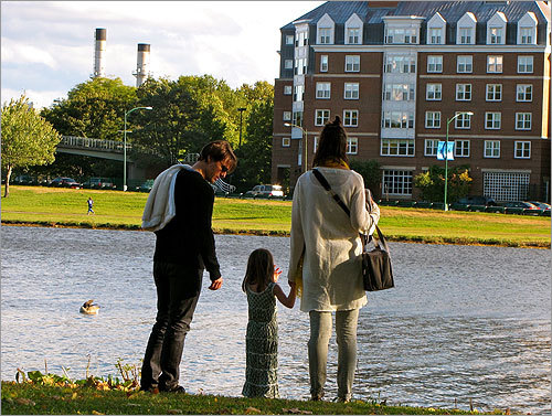 Tom, Suri, and Katie on the banks of the Charles in Cambridge.