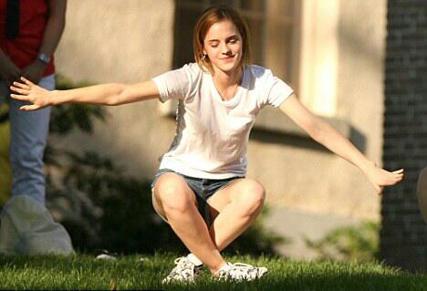 Emma Watson gracefully seats herself on the lawn at Brown University in RI