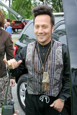 Rob Schneider give the hang loose sign to fans in Boston