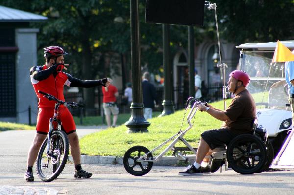 Joe Rogan give Kevin James the evil eye while biking around Boston Common